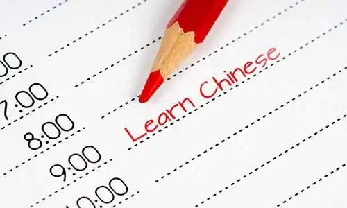 © MasterSergeant - stock.adobe.com | learn chinese, day schedule with red pencil