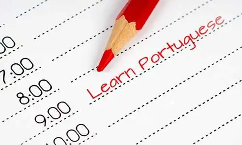 © MasterSergeant - stock.adobe.com | learn portuguese, day schedule with red pencil