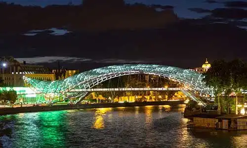 © stern_et - Fotolia | Night view of the brightly lit bridges of Peace